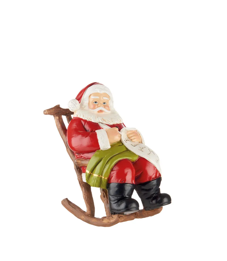 Babbo Natale decorativo su sedia a dondolo